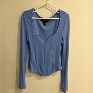Smal size Top 
Blue in color
Never worn because its small size for me